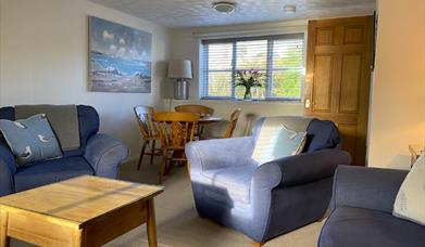 Lounge area with table and chairs by window