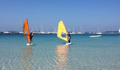Windsurfers on the water